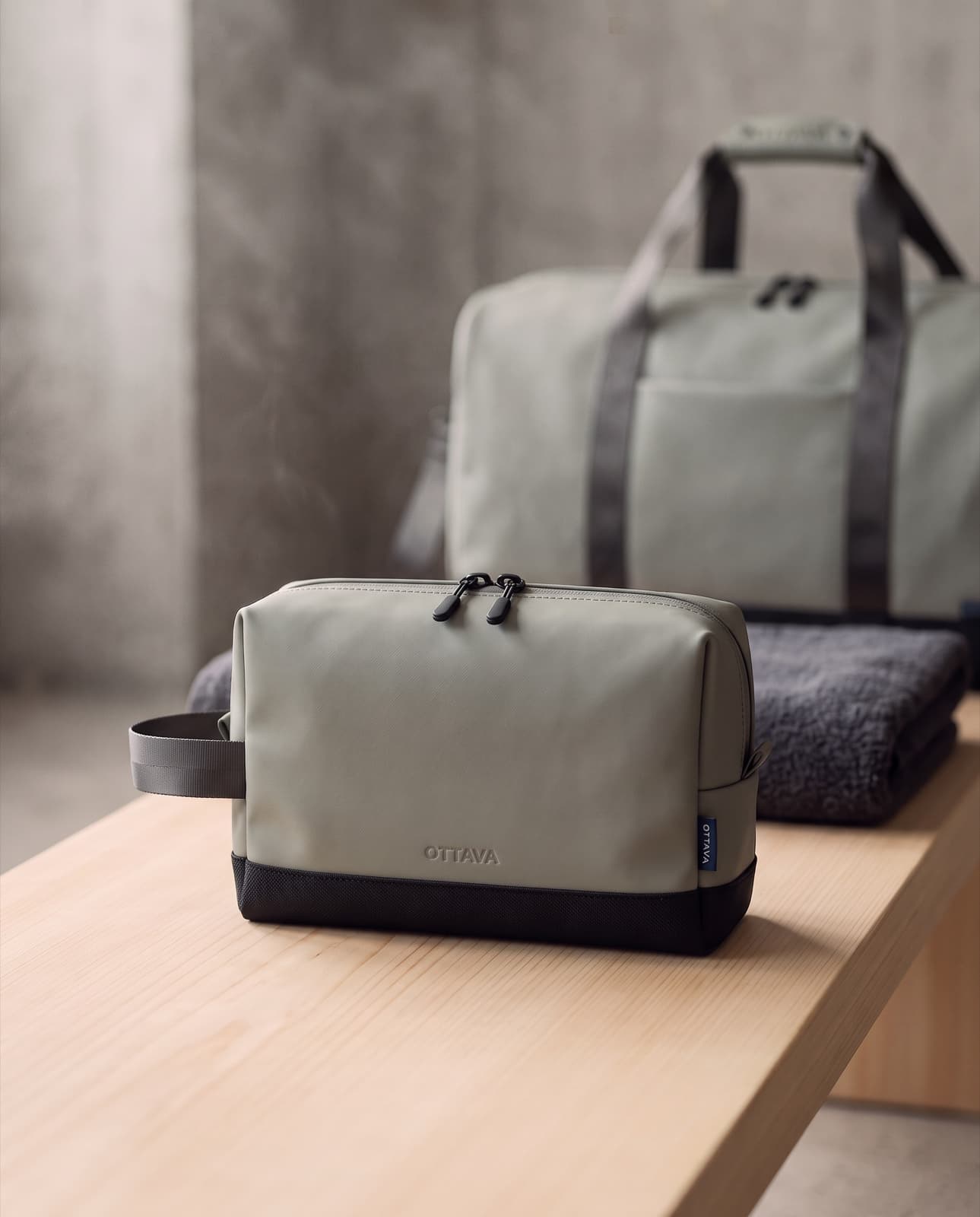 Grip Pouch on a spa bench with the Duffel 50 behind