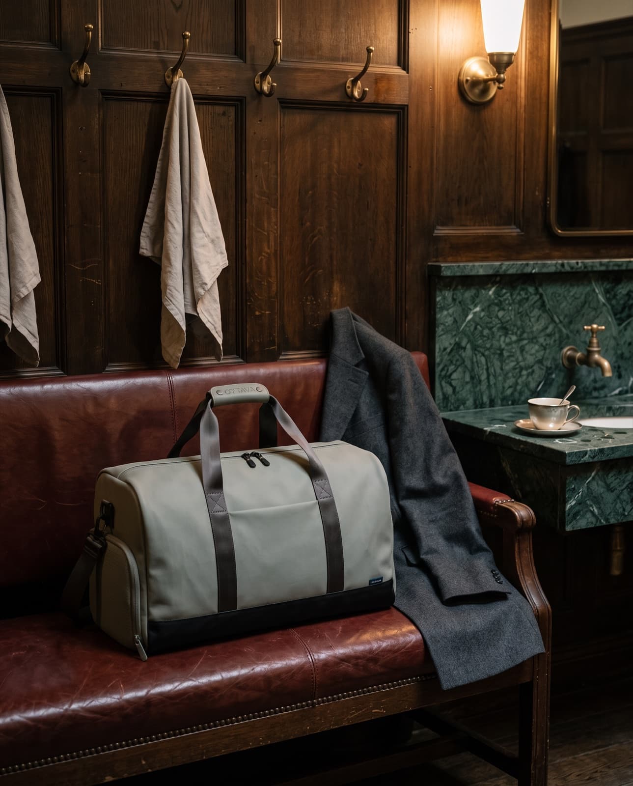 Duffel 40 on a leather bench in a London members' club changing room