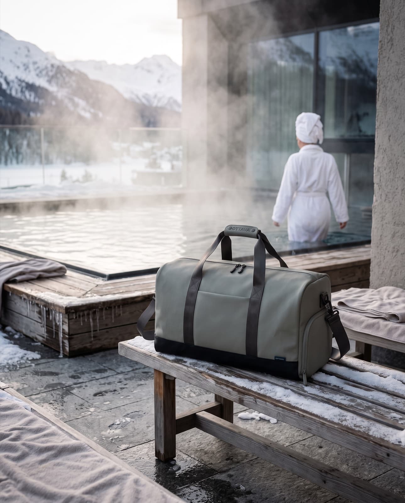 Duffel 40 beside a steaming alpine thermal pool in the snow